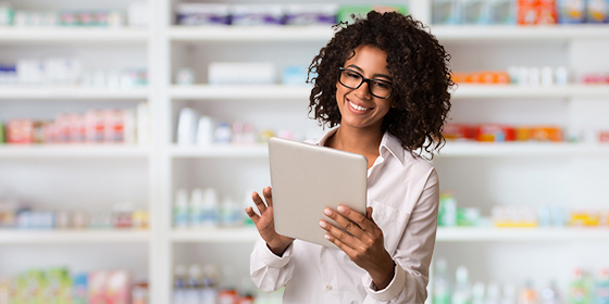 womanpharmacistwithtabletweb